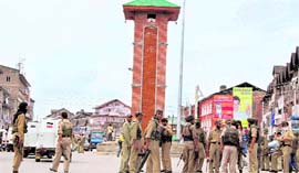 Security personnel keeping a strict vigil at Lal Chowk in Srinagar.