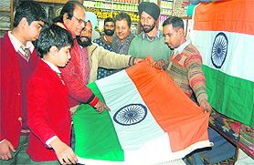 Students buy the Tricolour from Khadi Bhandar in Jalandhar on the eve of Republic Day on Tuesday.