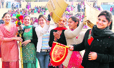 Girls share lighter moments during the Republic Day Parade rehearsal at the Guru Gobind Singh Stadium in Jalandhar