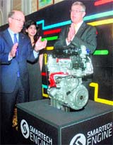 Tim Lee (L), President, General Motors International Operations and President and MD, General Motors India, Karl Slym pose with the companys new engine in New Delhi on Thursday.