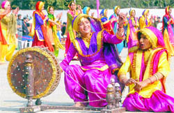 Schoolgirls perform after the parade in Chandigarh