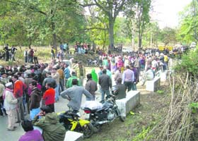 Protesters block the road at Ramnagar in Corbett Park