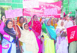Women workers of tea estates protest at the Gandhi Park in Dehradun on Thursday