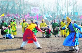 A contingent presents a dance item at the Republic Day function at Bakshi Stadium in Srinagar