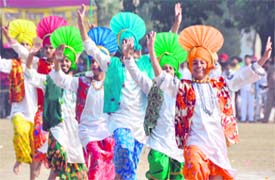 A cultural troupe presents bhangra during Republic Day celebrations in Ludhiana on Wednesday. 