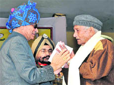 Punjab Governor Shivraj Patil honours a freedom fighter at the state-level Republic Day function at Guru Gobind Singh Stadium in Jalandhar on Wednesday. 