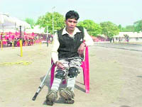 Saraj Kumar sits on a chair at the Republic Day function in Ferozepur after a tricycle given to him by the Deputy CM was taken away by Red Cross officials. 