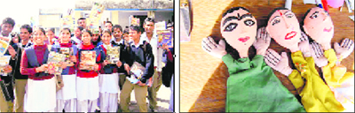 Students and; (right) puppets at the Science for All mela at Dakpathar in Dehradun district on Friday. 