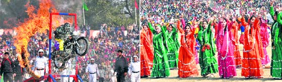 A member of the daredevil squad of the J&K police crosses a ring of fire during the Republic Day parade at MA Stadium in Jammu; and (right) Schoolgirls give a performance on the occasion.