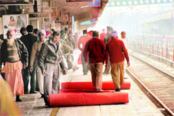 A red carpet being rolled out to welcome the Northern Railway General Manager in Ludhiana on Friday