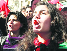 Jordanian women shout slogans as thousands of protesters demonstrated in Amman to press for political and economic reforms.