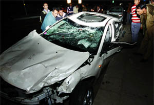 The mangled remains of a car after the collision of four vehicles on Taj Mansingh Road in New Delhi on Saturday.