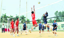 Players in action at a match of the All-India Public Sector Volleyball Tournament at the ONGC Volleyball Complex in Dehradun 