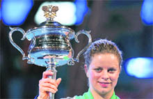 Kim Clijsters poses with her trophy after beating Li Na in their singles final at the Australian Open in Melbourne on Saturday. Clijsters won 3-6, 6-3, 6-3. 