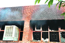 Smoke billows out of the record room in the Punjab and Haryana High Court where fire broke out in the wee hours of Sunday.
