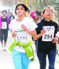 Girls take part in a mini-marathon organised by former students of Carmel Convent School in Chandigarh on Sunday.