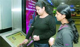 Girls check out the digital pod at Barakhamba Metro Station on Sunday.