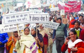 Thousands of people participate in a protest march against corruption from Ramlila Ground to Parliament House in New Delhi on Sunday.