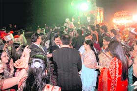 Baraatis dance on a road in Dehradun leaving no space for traffic movement