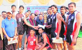 The ONGC team with the ONGC and BSNL All-India Public Sector Volleyball Tournament trophy in Dehradun