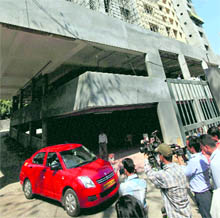 A CBI team carries out searches at the Adarsh Housing Society complex in Mumbai on Sunday