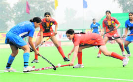Players in action during the final of the 1st Indian Senior Womens National Championship between Railways and Haryana at the Motilal Nehru Sports School in Sonepat on Sunday. Railways won the final beating Haryana 7-1.