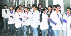 Students of PU’s dental college stage a protest on Monday.