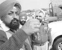 The police returns keys of vehicles to owners at a function in Phase 6, Mohali, on Monday.