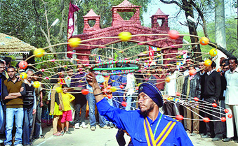An artiste from Punjab performs Gatkha during a media preview of the 25th Surajkund Crafts Fair in Haryana on Monday. Tribune photo: Manas Ranjan Bhui