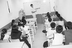 Students of Washington Elementary School, Taichung, Taiwan, are given advanced financial education, including international finance. 
