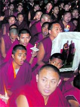 Tibetans hold a candlelight march in support of the Karmapa at Sidhbari near Dharamsala on Monday.