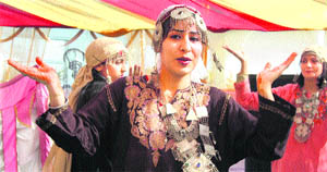 Students give a performance at the Annual Day function of New Modern Group of Colleges in Jammu on Monday. 