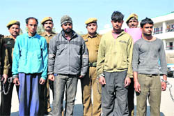 Four accused in the murder of beautician Nisha at the police control room in Jammu on Monday.