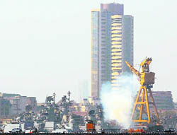 Smoke billows from INS Vindhyagiri, which caught fire after a collision with a merchant vessel, at the Naval dockyard in Mumbai on Monday.