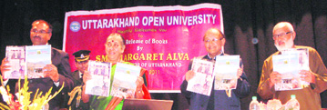 Governor Margaret Alva releases publications of Uttarakhand Open University in Dehradun on Tuesday.