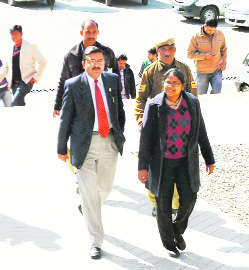 V Neerja (R), DIG Enforcement, Chandigarh, along with officials, goes to inspect the Karmapas monastery at Sidhbari on Tuesday. Photo: Kamaljeet
