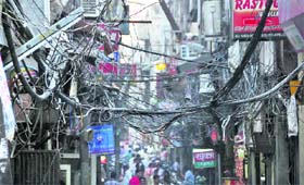 A dangerous network of electricity wires in the congested Sarafa Bazar poses a threat to the residents of the area