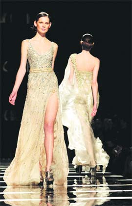 Models wear creations by fashion designer Tony Ward during his Spring-Summer 2011 collection at the AltaRoma Fashion Week in Rome