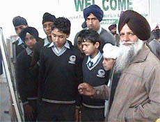 An official of the wildlife department showing pictures to the students at Hari Ke wetland sanctuary on Wednesday