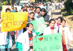 Students of the HSJ Institute of Dental Sciences and Hospital march to the chemistry department of Panjab University in Chandigarh on Wednesday. 