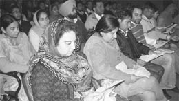 People look at their employment letters in a function at the Punjab Education Board office in Mohali on Wednesday.