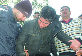 The two arrested for extortion bid are produced before media at PHQ in New Delhi on Wednesday.