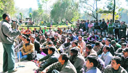 Employees of power corporations hold a protest at the Gandhi Park in Dehradun