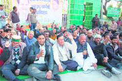 Congress workers hold a demonstration against the renaming of Uttarakhand Technical University at the Gandhi Park, Dehradun