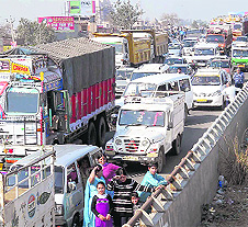 Vehicles stranded on the NH-1 after a protest by residents of Teha village in Sonepat.