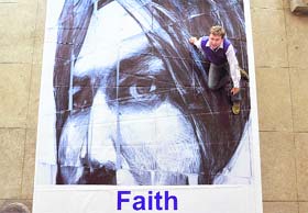 Danial Connell ‘sits’ on the poster of one of his sketches