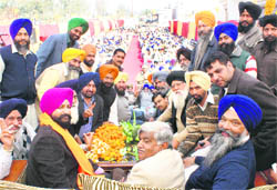 Prem Singh Chandumajra (right) at a gathering of party workers and villagers