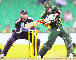 Michael Clarke hits one to the fence against England in Sydney on Wednesday.