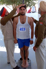 Cops taking the measurements of a candidate for the post of constable in Punjab Police, at the Police Lines in Bathinda on Thursday