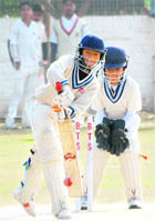 An APJ Kharar batsman plays a shot during a semifinal match of the DP Azad Winter League Tournament in Chandigarh on Thursday.